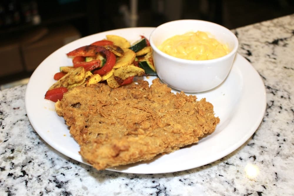 The chicken-fried steak is made with American wagyu beef and topped with signature gravy. (Ally Bolender/Community Impact Newspaper)