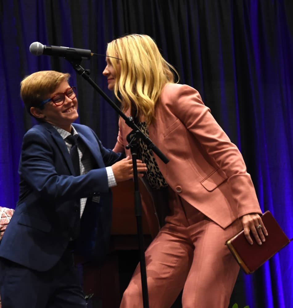 New Fort Worth Mayor Mattie Parker shares a moment with one of her children after being sworn in. (Steven Ryzewski/Community Impact Newspaper)