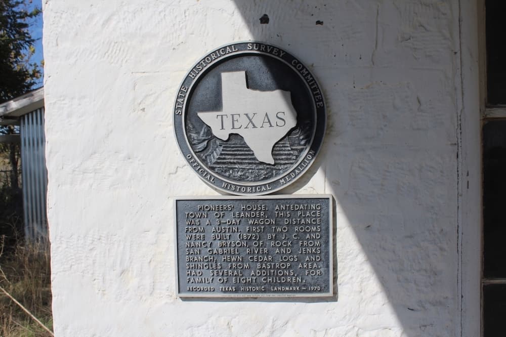 A historical marker shares background information on the Bryson Farmstead, which was built in 1872. (Community Impact Newspaper staff)