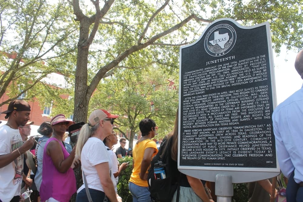 A Juneteenth-related marker was placed at 22nd and Strand in 2014, but Sam Collins said he noticed people did not often read the words on the marker. (Colleen Ferguson/Community Impact Newspaper)
