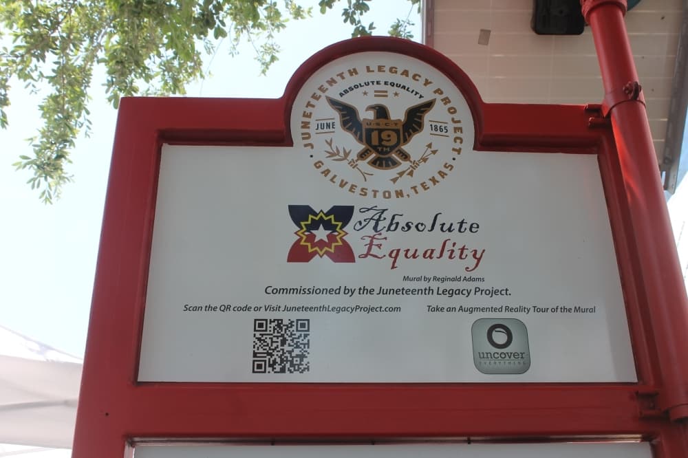 Mural visitors can use the Uncover Everything app to go on an augmented reality tour and learn about Juneteenth's history. (Colleen Ferguson/Community Impact Newspaper)