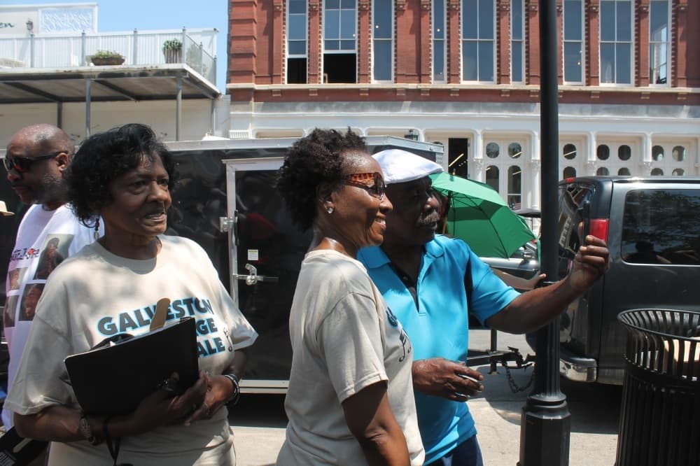 Members of the Galveston Heritage Choir posed for photos with audience members post-performance. (Colleen Ferguson/Community Impact Newspaper)