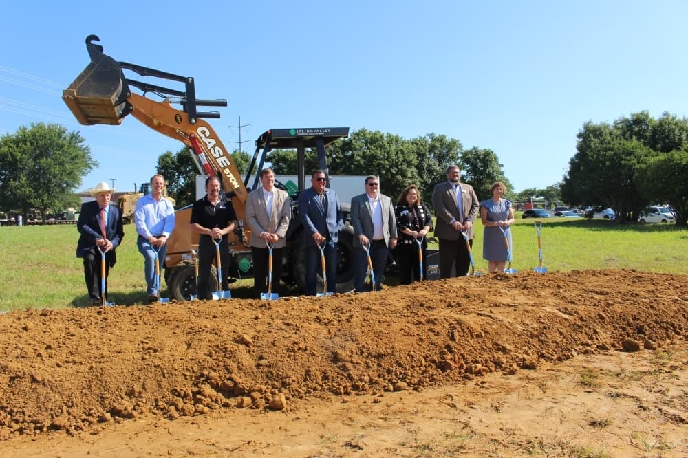 City of McKinney and Collin County officials take a picture at the groundbreaking site for the new Speese Campus. (Miranda Jaimes/Community Impact Newspaper)