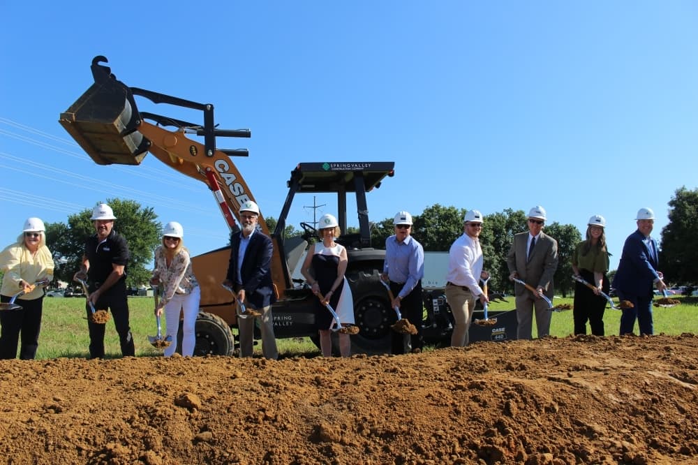 McKinney and the Children's Advocacy Center of Collin County officials prepare to fling the first dirt on the Speese Campus project. (Miranda Jaimes/Community Impact Newspaper)