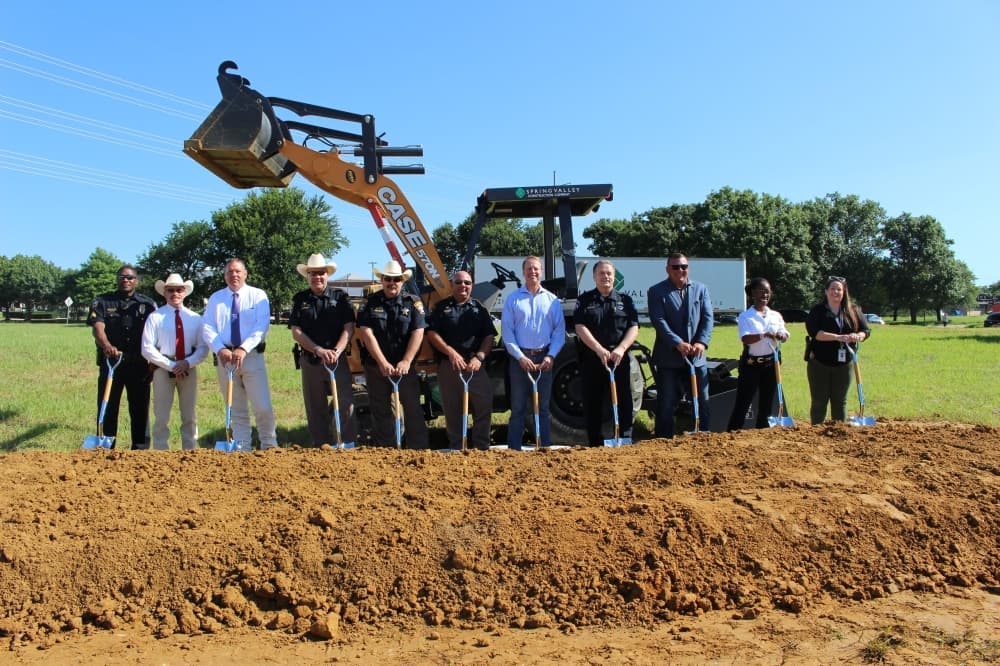 Law enforcement in attendance of the Speese Campus groundbreaking pose for a photo together. (Miranda Jaimes/Community Impact Newspaper)