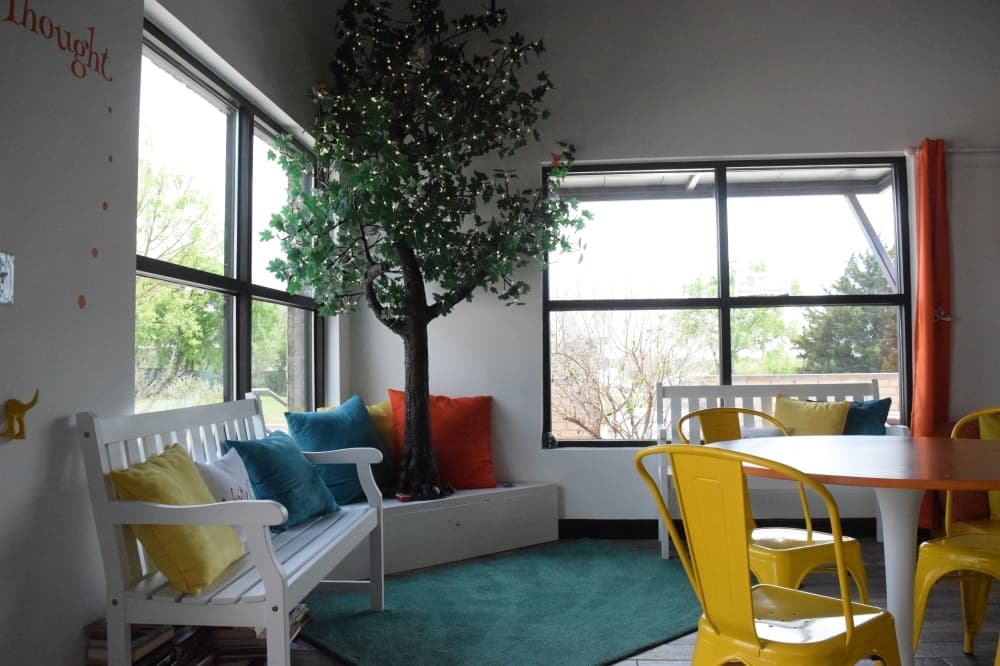 A makeshift tree and benches serve as a callback to Rice’s original inspiration to open a nature-themed bookstore. (Matt Payne/Community Impact Newspaper)