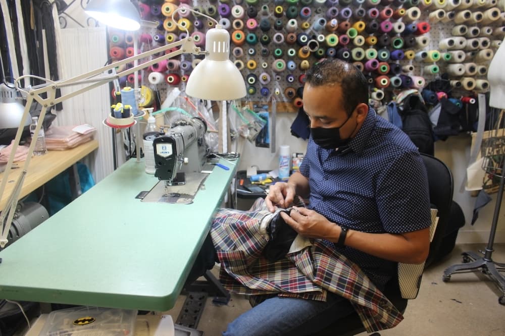 Photo of a man at sewing machine