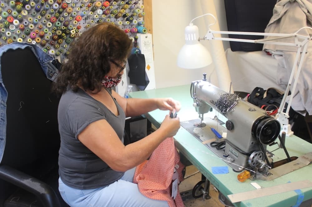 Photoo of a woman at a sewing machine