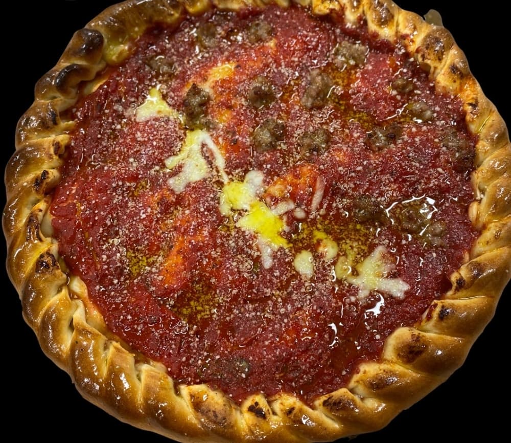 This small Chicago-style stuffed pizza ($13.95) comes with two layers of crust stuffed with cheese and toppings covered in our house red sauce. (Courtesy Sabino's Pizza Pub)