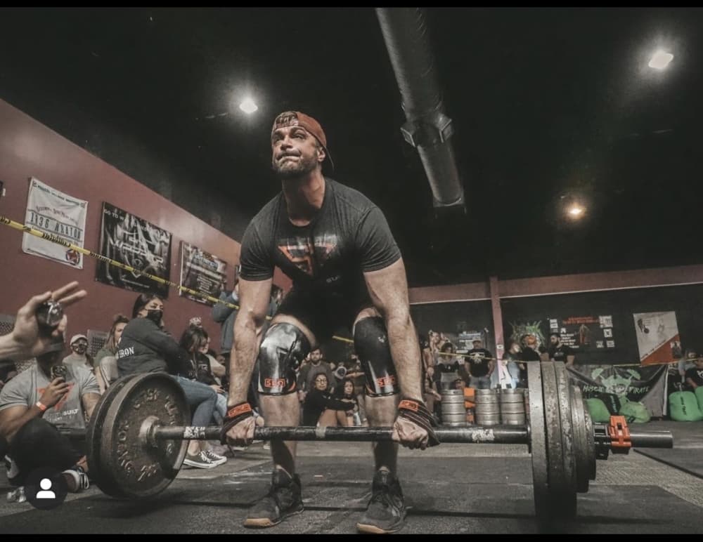 Klaproth completes axle bar deadlifts during a competition. (Lauren Canterberry/Community Impact Newspaper)