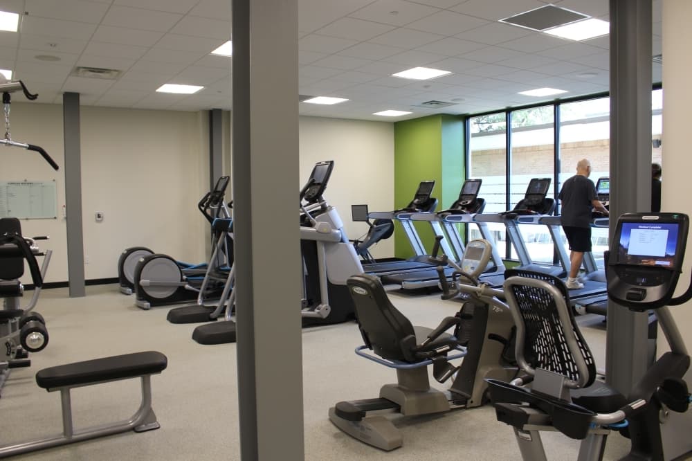 The renovated center includes a large fitness room with new exercise equipment. (Olivia Lueckemeyer/Community Impact Newspaper)