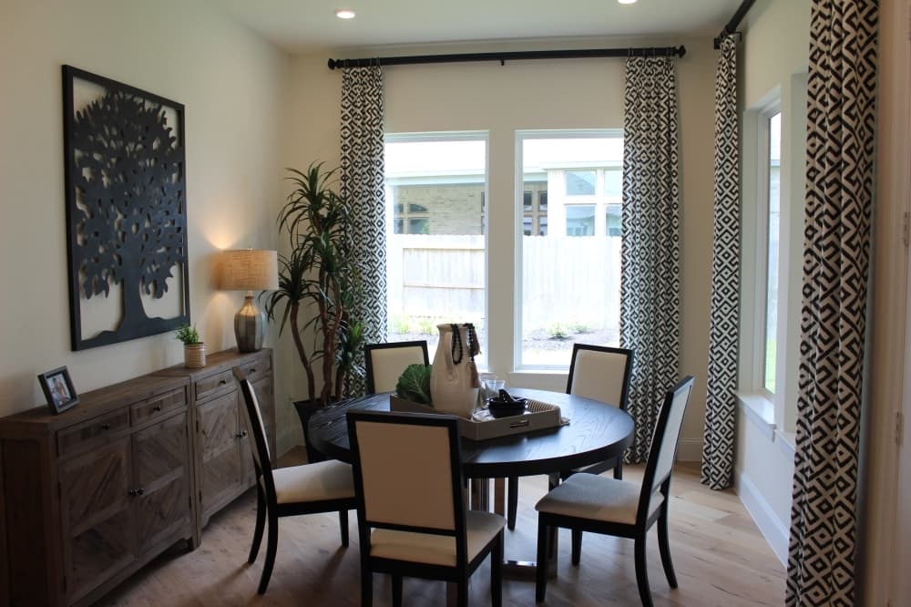 The home includes an informal dining area next to the kitchen with a larger dining room next to the front entrance.
