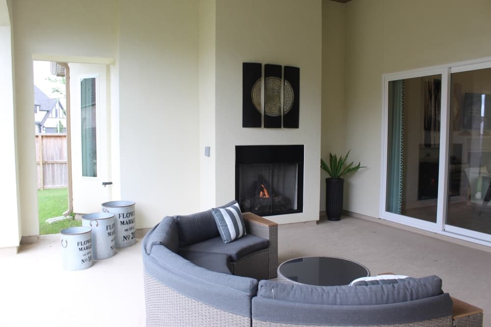 Standard in all Shea Homes 70-foot series houses, the covered patio outside the living room comes with the option of a fireplace add-on.