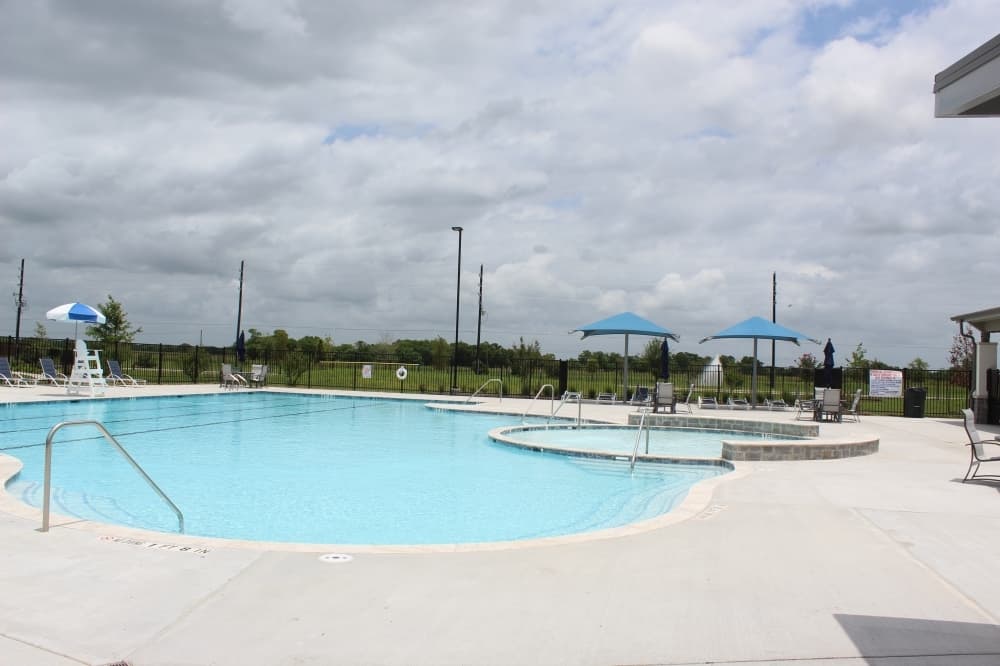 An outdoor pool at the Jaxon’s Cove recreation center is one of the many offered neighborhood amenities at Del Bello Lakes.