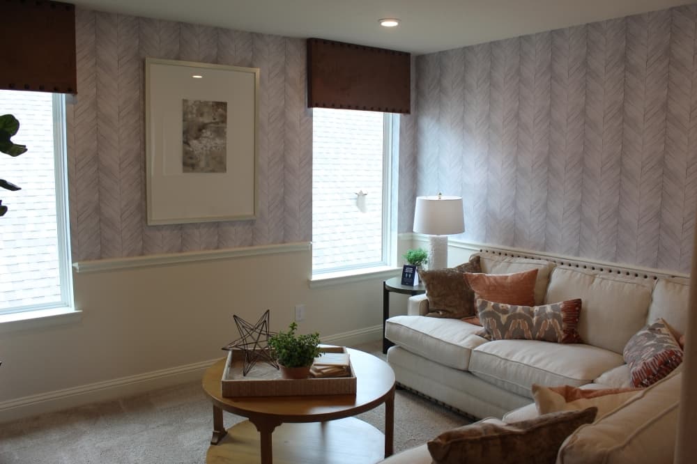 An add-on, this bonus room upstairs serves as a flex space for homeowners.