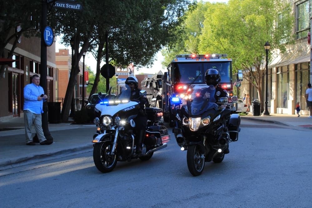 Southlake's Department of Public Safety paraded along with Hailey Hernandez around Town Square. (Sandra Sadek/Community Impact Newspaper)