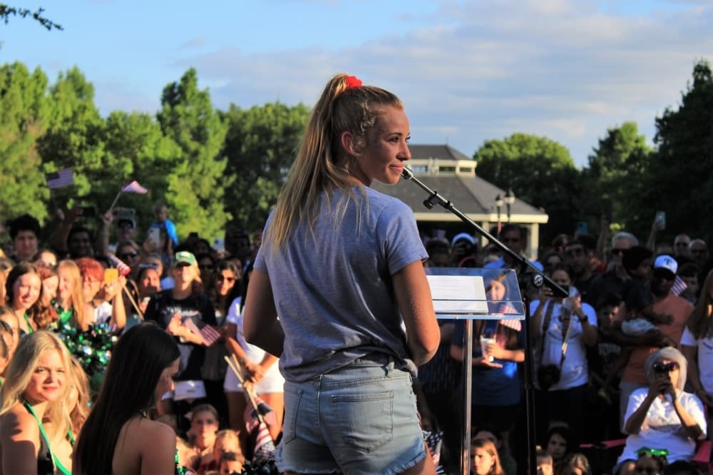 Southlake Olympian Hailey Hernandez gives a speech in front of the community at Town Square. (Sandra Sadek/Community Impact Newspaper)