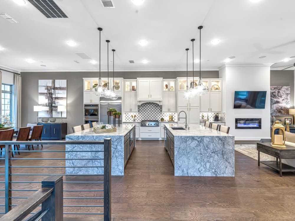 Large, open floorplans in the kitchen offer breakfast seating areas with suspended lighting. (Photos courtesy Taylor Morrison)