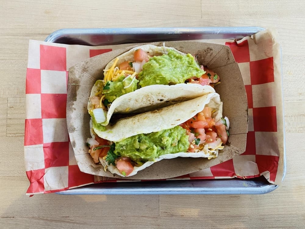 Ground Beef Tacos ($3.35 each) comprised of ground beef, pico de gallo, shredded cheese and guacamole. (Kaushiki Roy/Community Impact Newspaper)