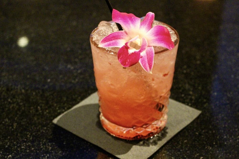 A Zarinity Now cocktail consists of gin, raspberry preserves, lemon and rosewater. (Andrew Christman/Community Impact Newspaper)
