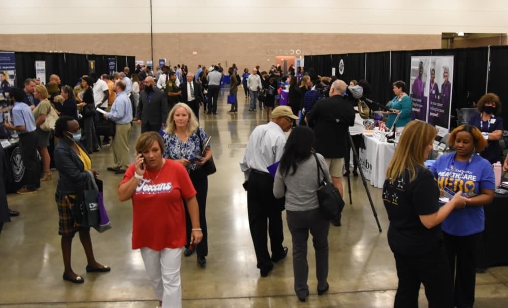 The floor of the Irving Convention Center was busy during the job fair. (Steven Ryzewski/Community Impact Newspaper)