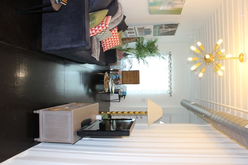 The living room in the model home is supplied with furniture from the McKinney ReStore. (Miranda Jaimes/Community Impact Newspaper)
