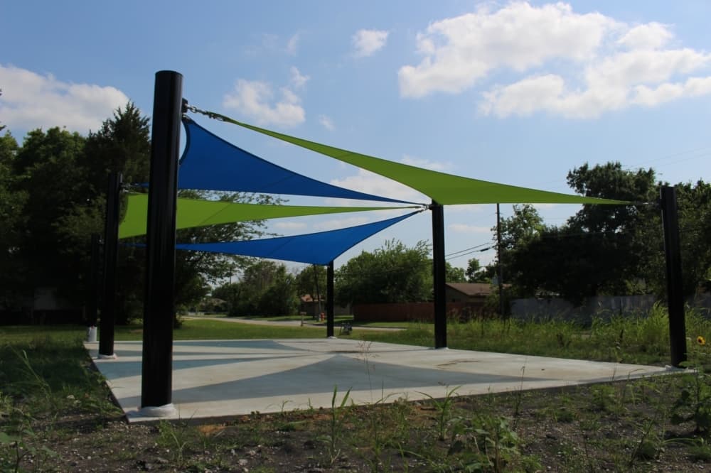 The awning that will cover the upcoming playground at The Cotton Groves has been installed. (Miranda Jaimes/Community Impact Newspaper)