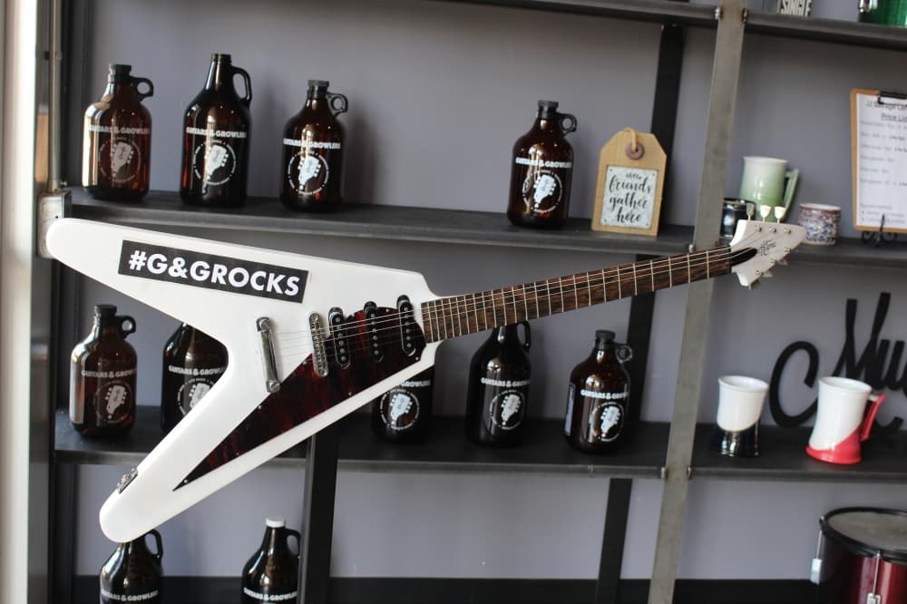 At Guitars & Growlers, customers can fill a 65-ounce container with their beer of choice that then gets sealed for on-the-go transport. (Brooklynn Cooper/Community Impact Newspaper)