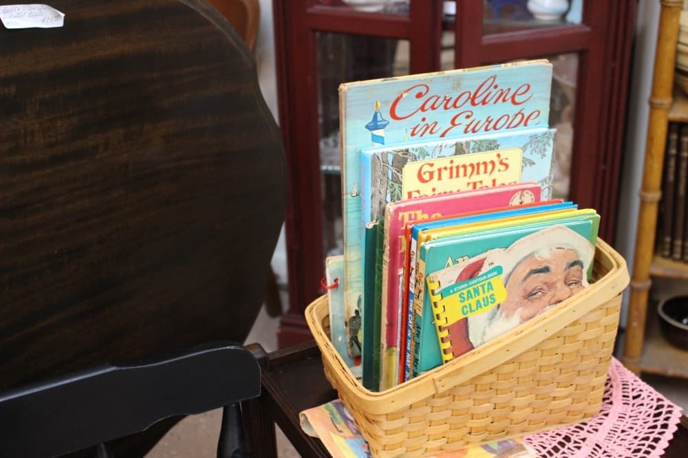 Antique children's books, toys and clothing are sold at KT Antiques.