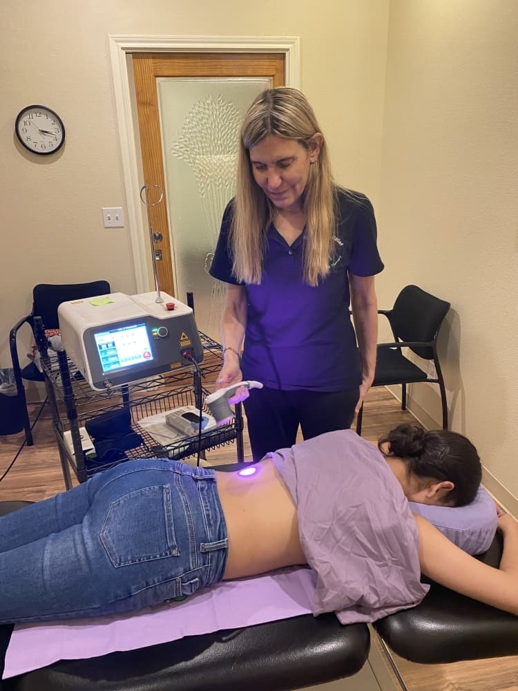 


Teresa Poindexter conducts a high-intensity laser treatment that causes rapid healing at the cellular level. (Courtesy Georgetown Physical Therapy)