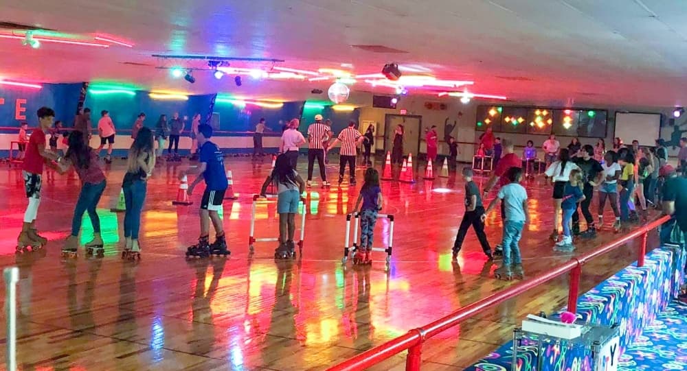 Patrons dance on skates to the hokey-pokey at the Humble Family Skate Center. (Courtesy Humble Family Skate Center)