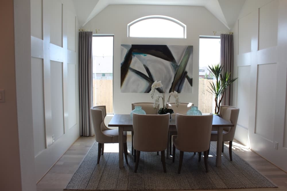 A formal dining room is located near the front entrance and is connected to the kitchen in an open floor plan. (Savannah Kuchar/Community Impact Newspaper)