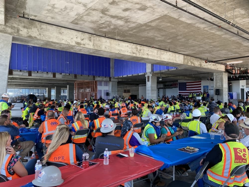 Workers who contributed to the project celebrated topping out the structure July 22. (Trent Thompson/Community Impact Newspaper)