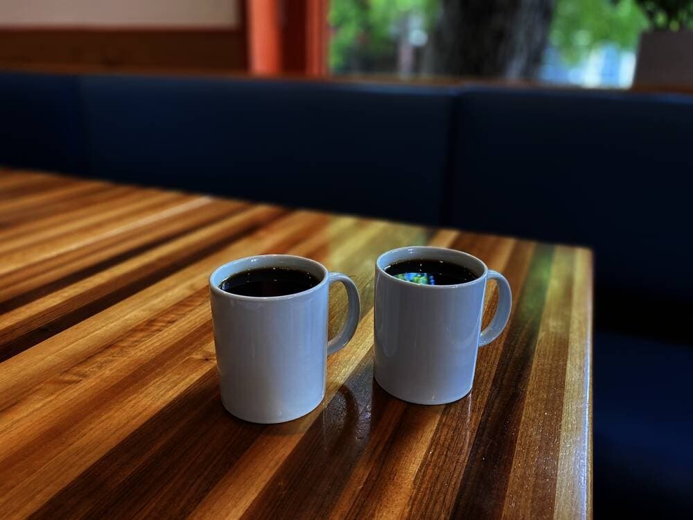 Photo of two mugs of coffee