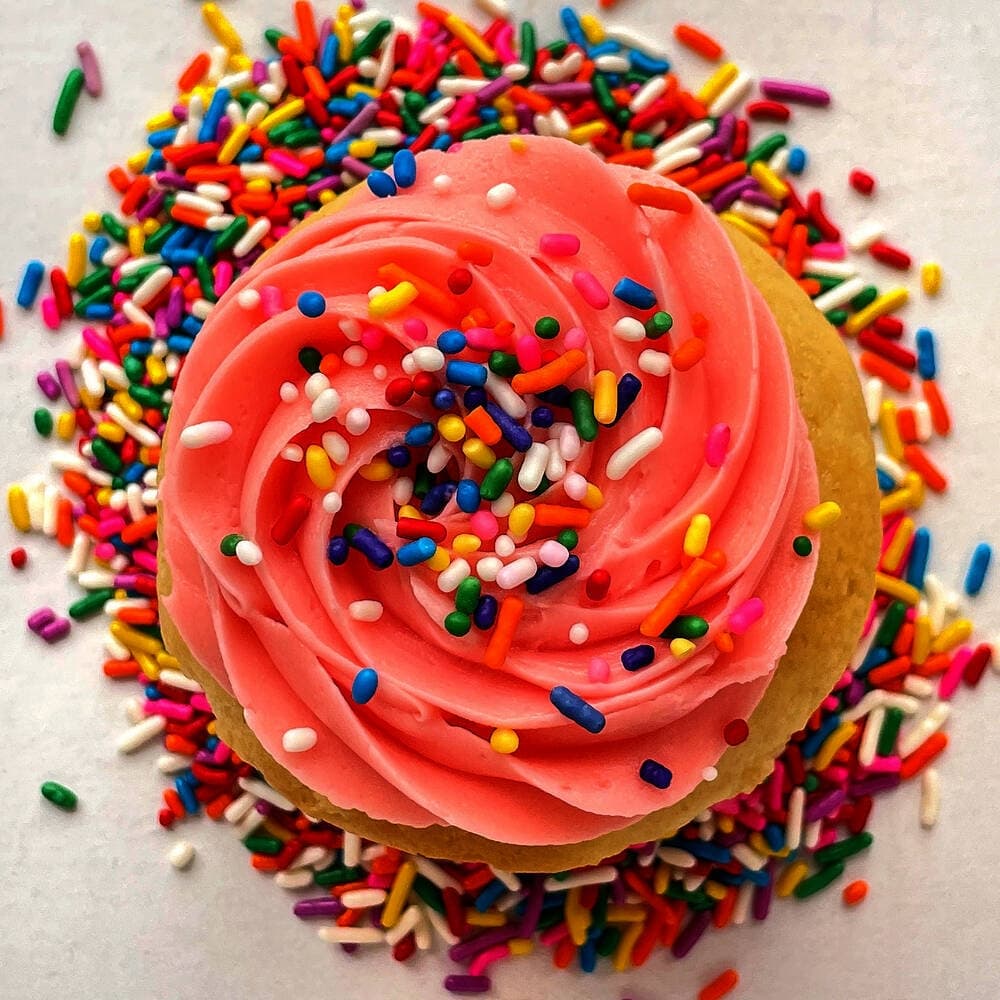 Photo of a pink frosted cupcake
