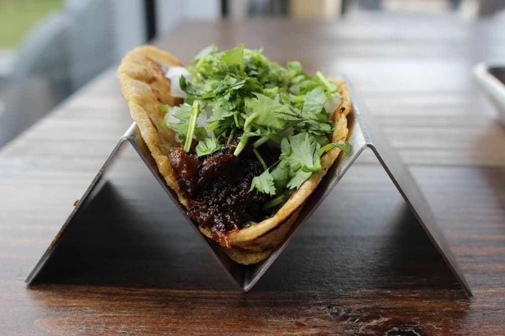 Apart from sliced meats, Bexar Barbecue offers street tacos ($5) and sides at its Tomball eatery. (Chandler France/Community Impact Newspaper)