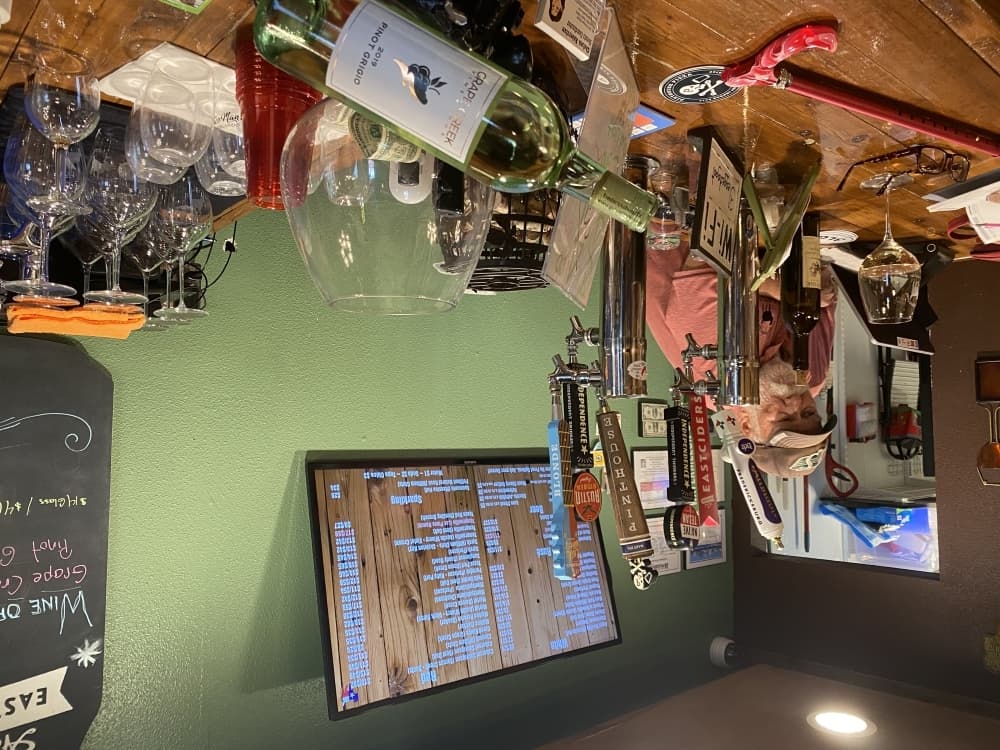 Dale “Woody” Woodkey helms the bar at Three Legged Goat on a recent Thursday evening. (Brian Rash/Community Impact Newspaper)