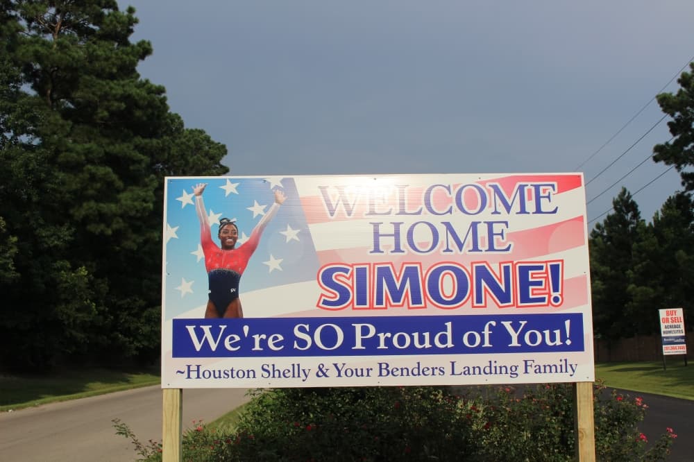 Rayford Road was decorated with large welcome signs for the local Olympic athlete. (Ally Bolender/Community Impact Newspaper)