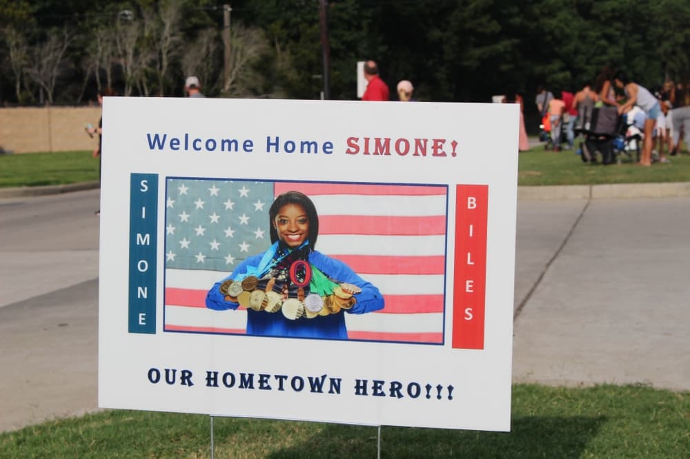 Signs welcomed the decorated Olympic athlete home. (Ally Bolender/Community Impact Newspaper)