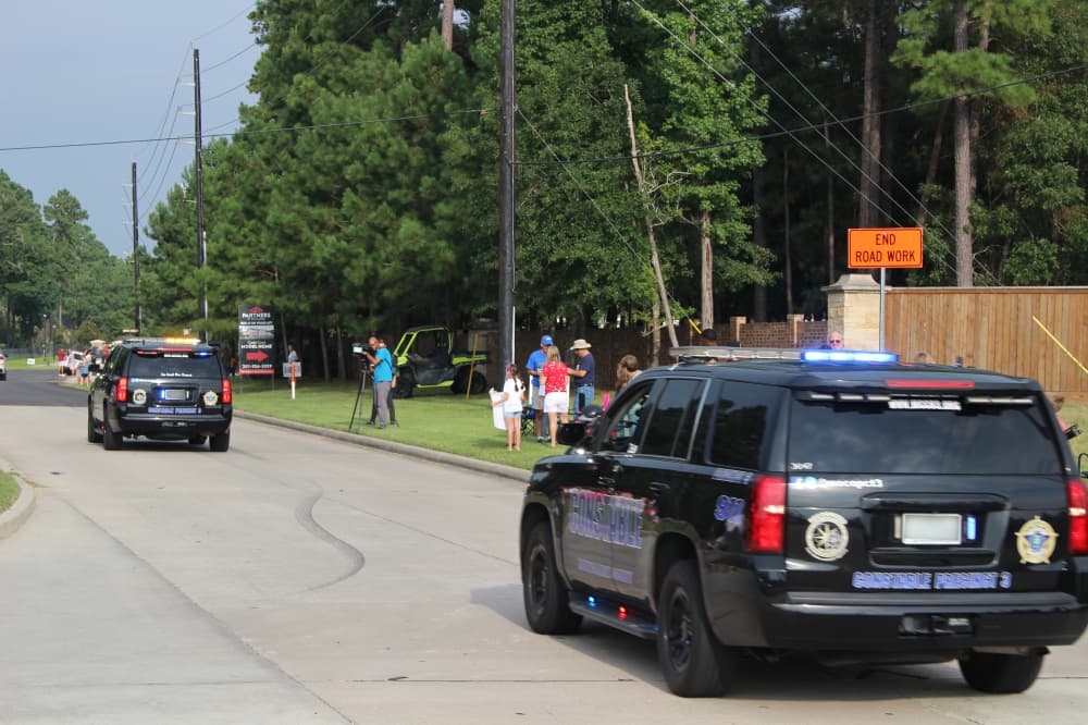 Police escorted Biles and Chiles down Rayford Road. (Ally Bolender/Community Impact Newspaper)