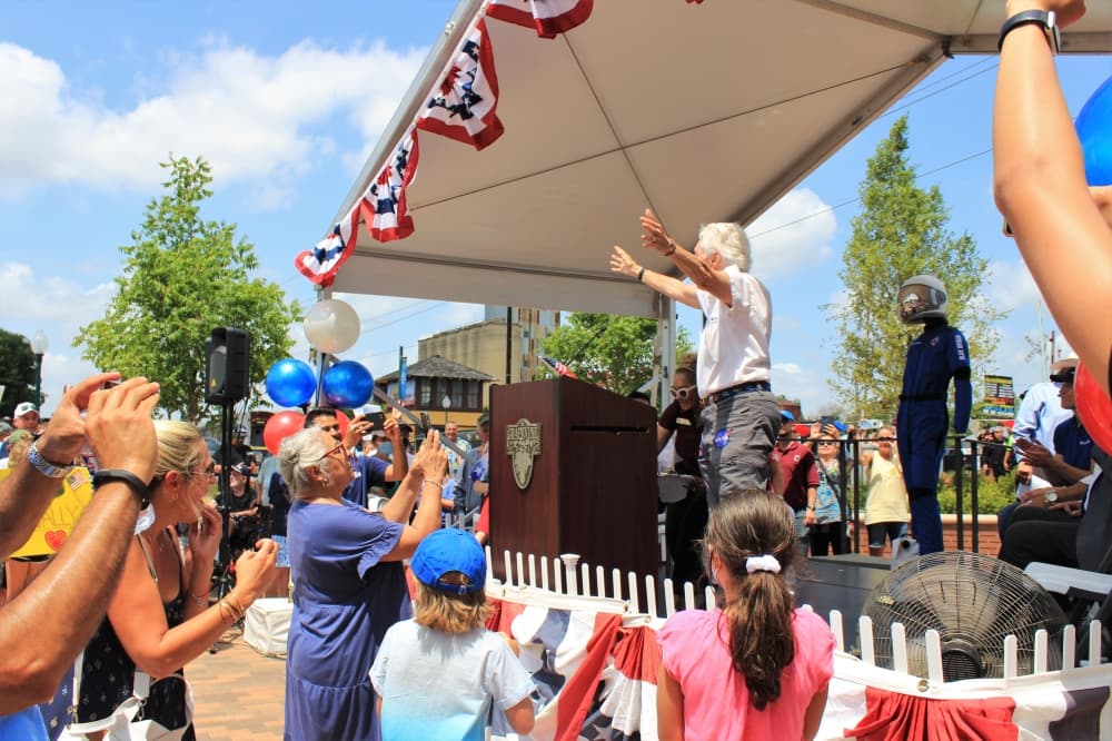 Wally Funk waves to a cheering crowd during her celebratory parade on Aug. 7. (Sandra Sadek/Community Impact Newspaper)