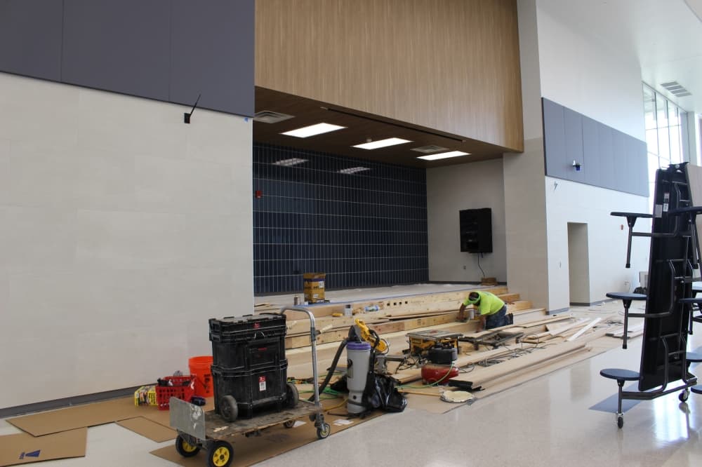 The finishing touches were being placed at the cafeteria's announcement area on Aug. 9. (Miranda Jaimes/Community Impact Newspaper)
