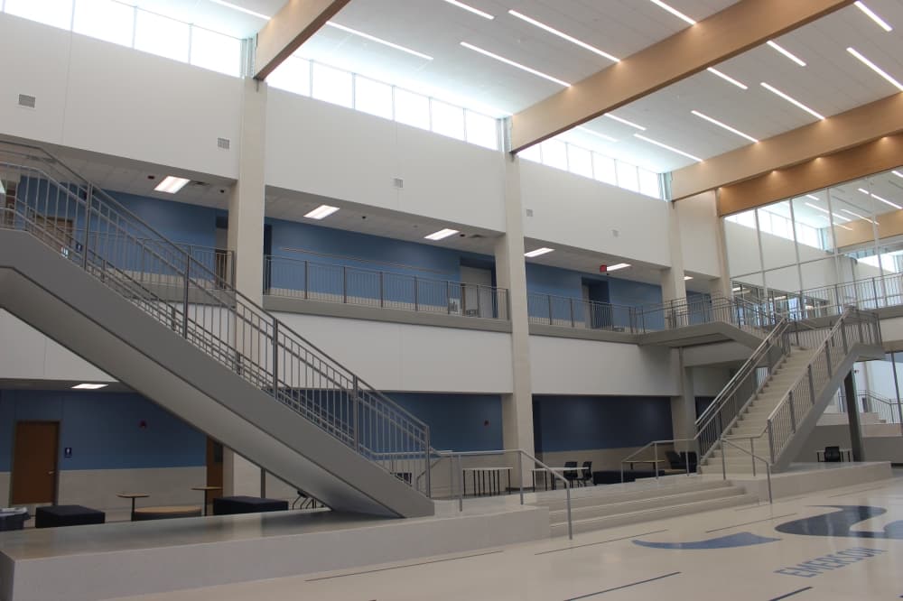 Students are greeted by a main staircase when they enter the school. (Miranda Jaimes/Community Impact Newspaper)
