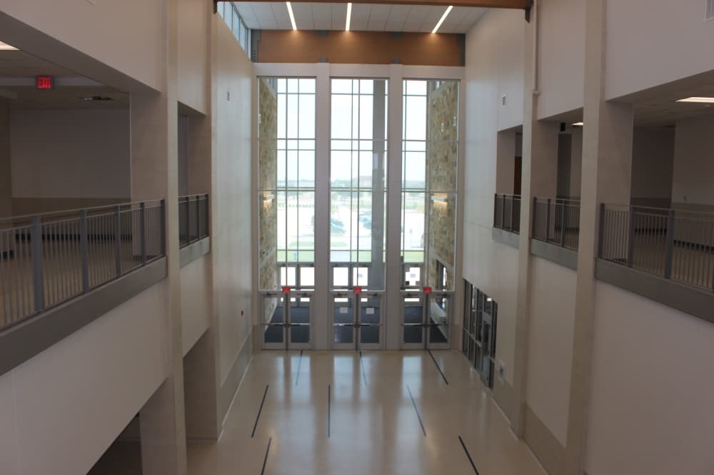 The main entrance of the campus extends to the ceiling and is provides a clear line of sight from the front of the school to the rear. (Miranda Jaimes/Community Impact Newspaper) 