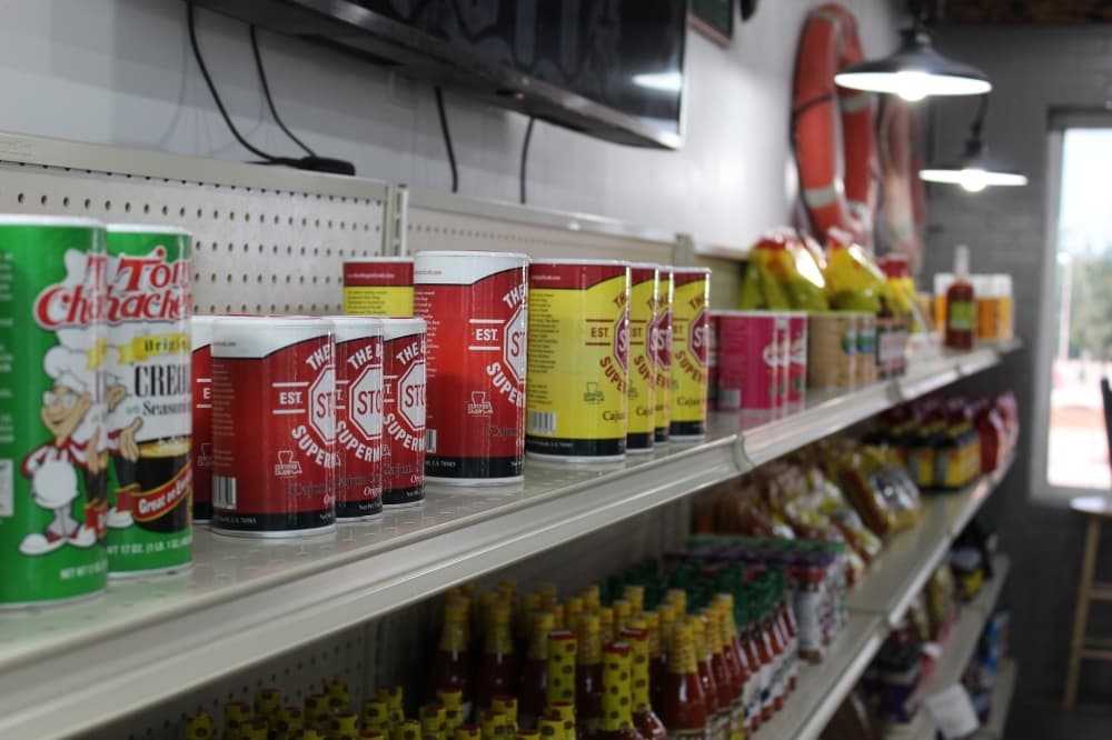 In addition to hot food, THE Cajun Market also sells seasonings, sauces, meats and more items that are hard to find outside of Cajun country. (Kira Lovell/Community Impact Newspaper)