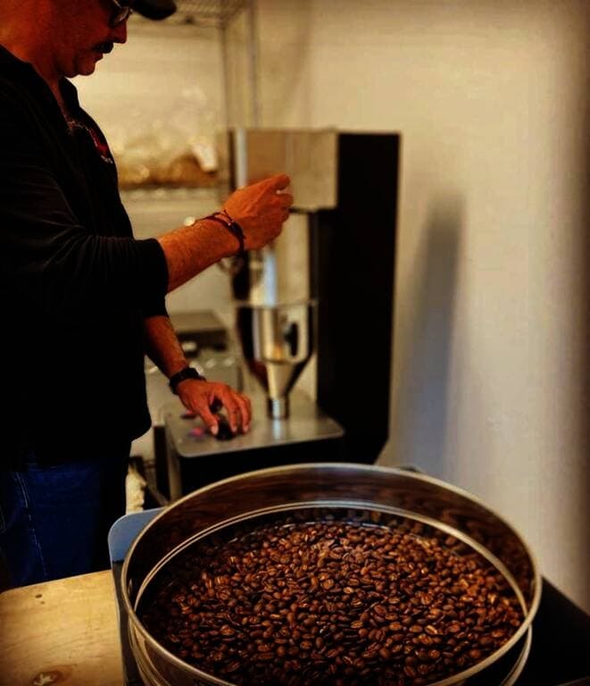 
Brockus’ business partner Enrique Macias roasts a small batch of coffee beans. (Courtesy Artisan Culture)