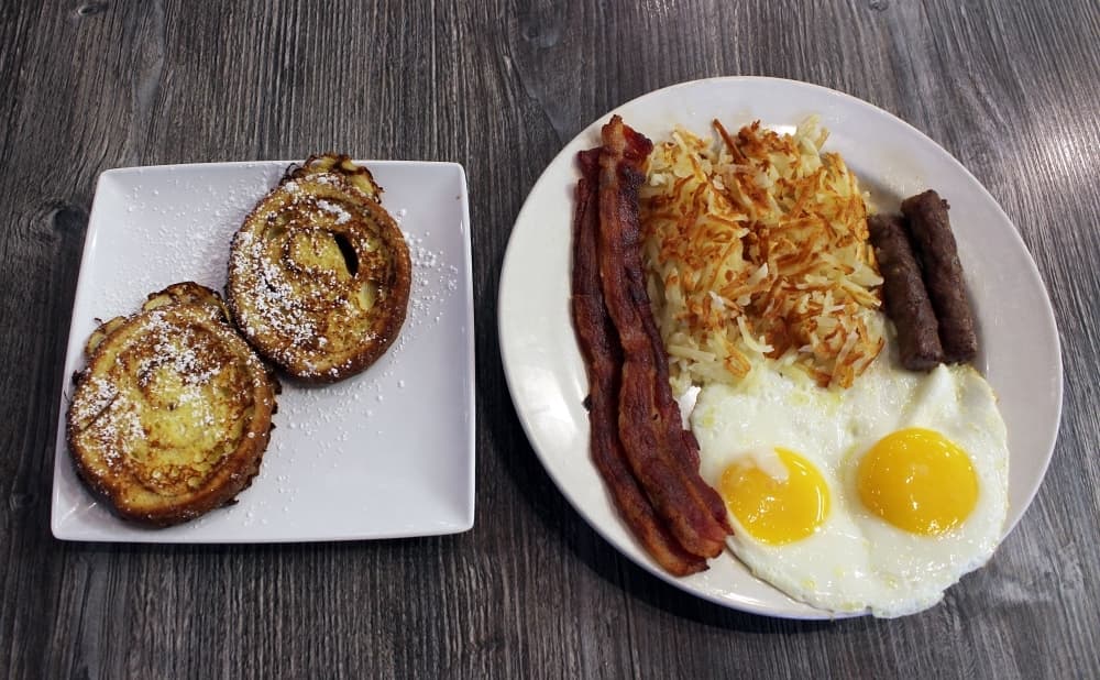 The Lumberjack ($10.99) comes with two eggs, two slices of bacon, two sausage links, hash browns and two slices of cinnamon French toast. (Karen Chaney/Community Impact Newspaper)