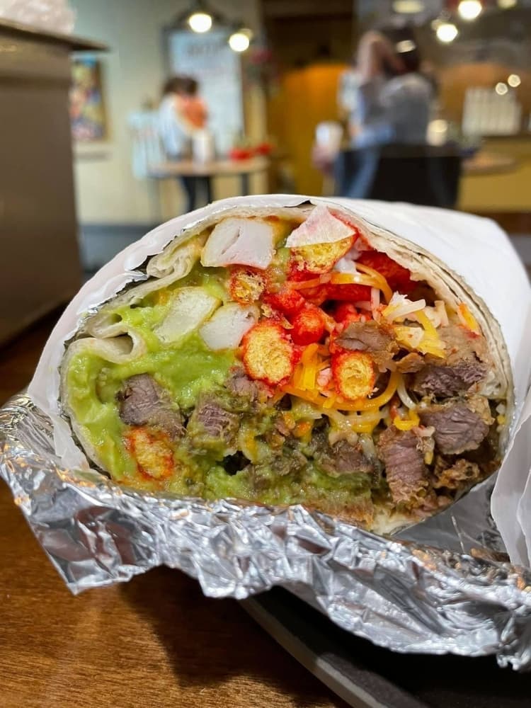 The Cali Burrito ($10.75) comes with grilled carne asada on a large flour tortilla with french fries, cheese, sour cream and guacamole. (Courtesy Mikey V's)