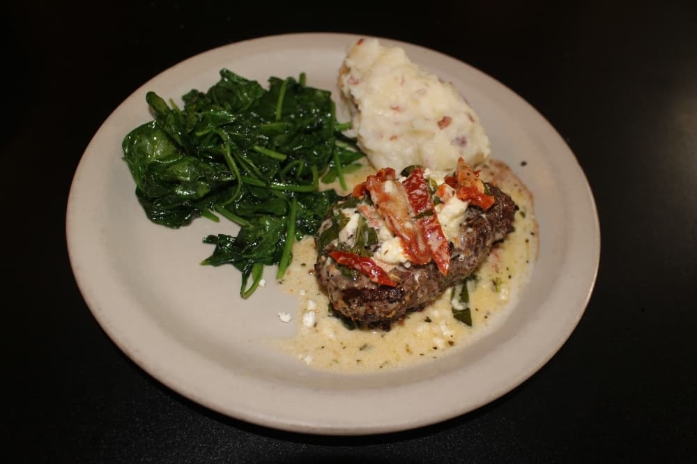 The beef entree ($17.95) is topped with fresh herb butter and served with two sides. (Photos by Eva Vigh/Community Impact Newspaper)
