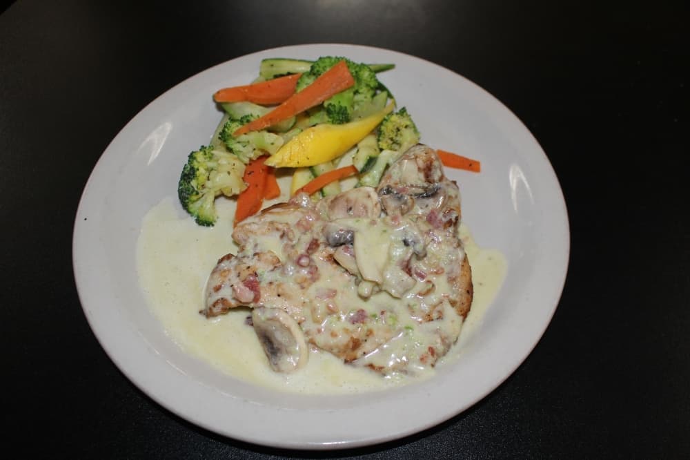Topped with mushrooms and bacon in a jalapeno cream sauce, the dish ($13.95) is served with two sides. (Photos by Eva Vigh/Community Impact Newspaper)